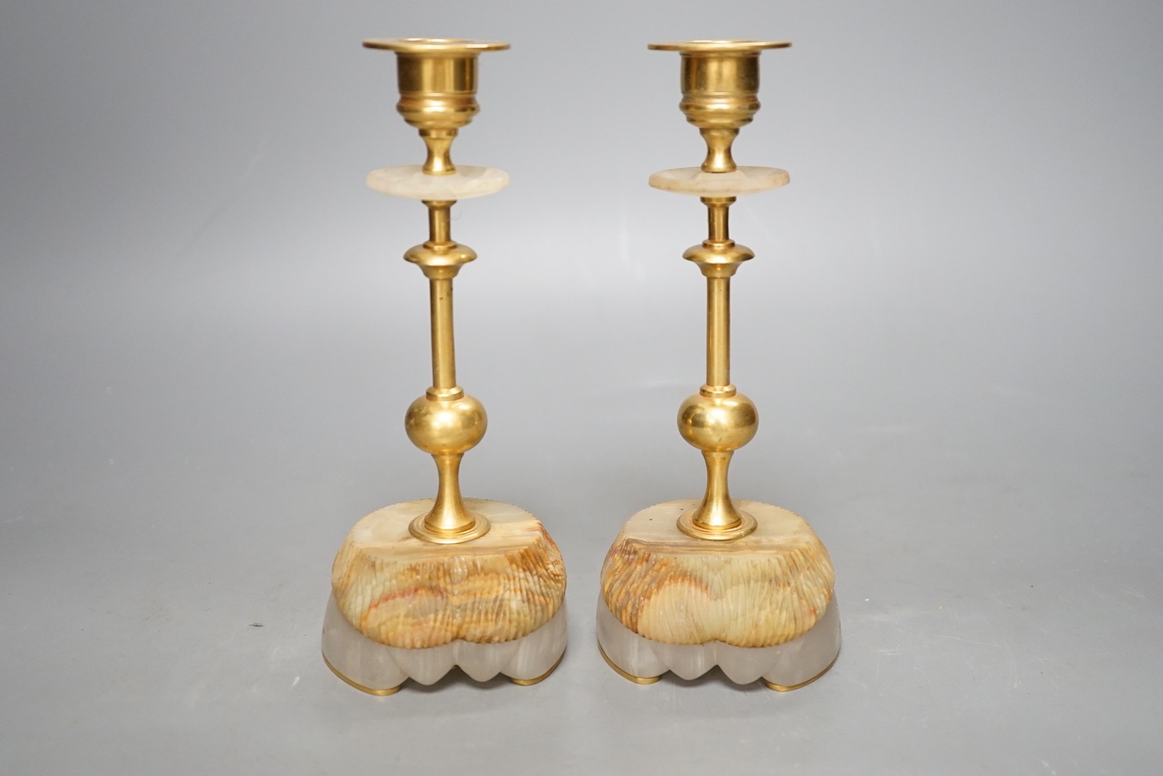A pair of gilt metal and hardstone 'hoof' candlesticks, 19cm